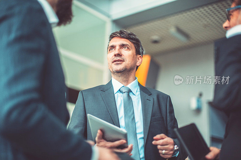 Group of business people in the office building lobby